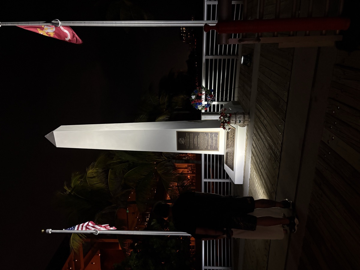 Memorial at Night - Visitor Reading Plaque